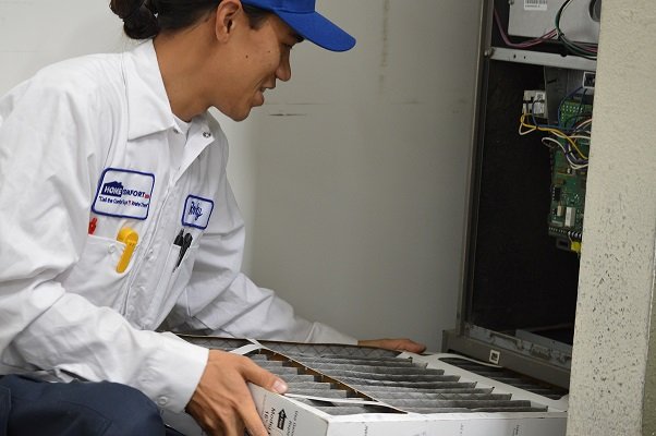 A technician fixing a heater