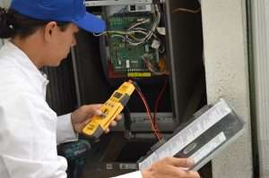 A tech repairing a heater