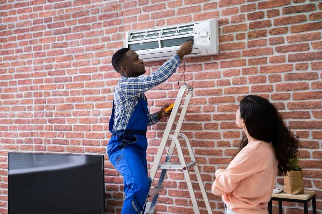 Tech doing an AC repair