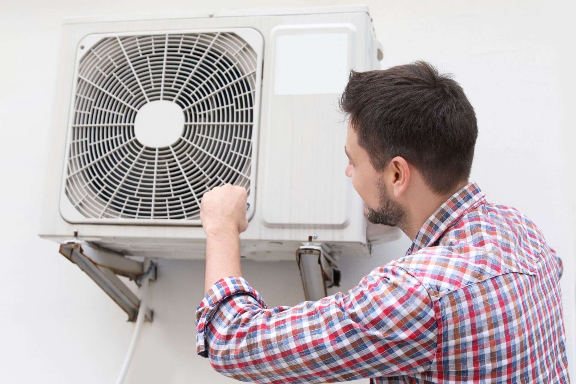 A tech is providing AC services