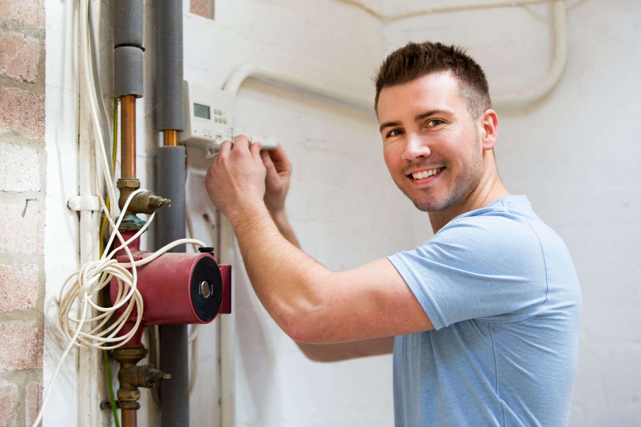 tech installing a home heating system