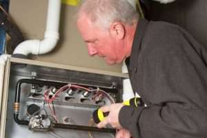 a tech checking if a furnace is effective