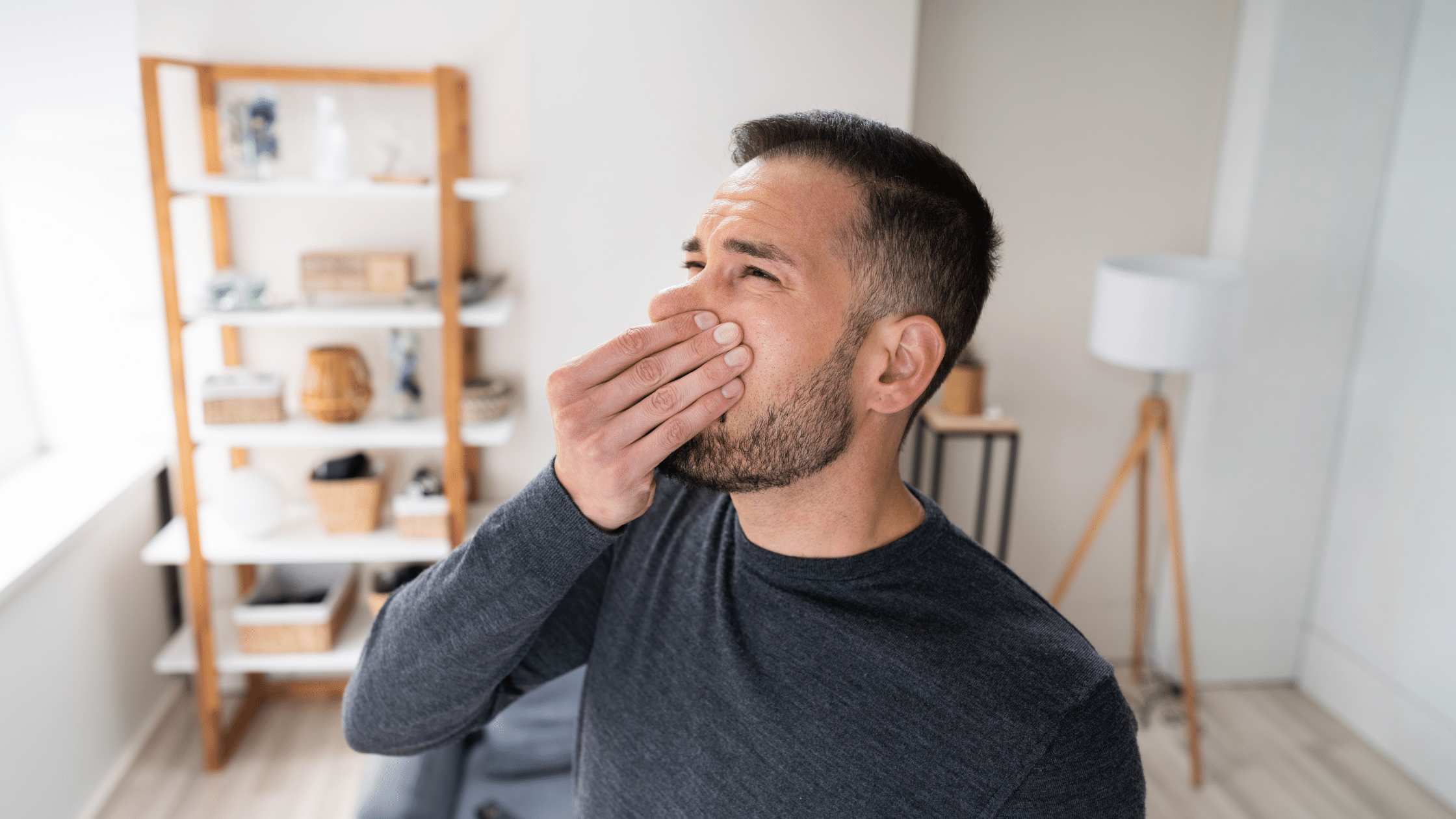 Man pinching his nose due to a bad smell