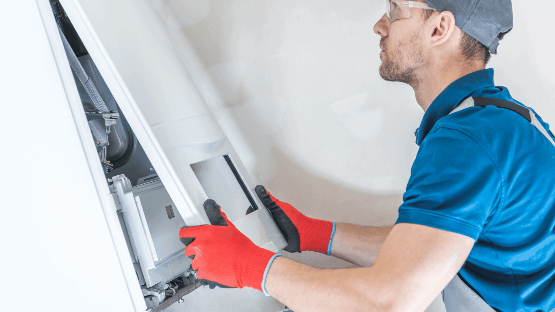 image of an HVAC tech working on a furnace