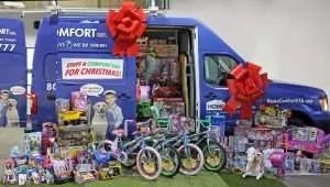 Employees of Home Comfort Cooling, Heating & Plumbing Stuff a Truck Event For Sheepfold